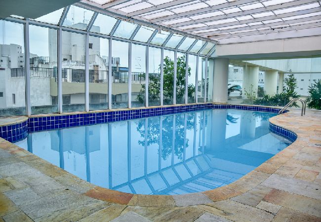 Apartamento em Guarujá - Flat com piscina e lazer na Praia de Pitangueiras Apartamento em Guarujá - Flat com piscina e lazer na Praia de Pitangueiras