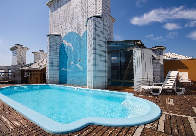 Apartamento em Capão da Canoa - Apto c churrasq, piscina e wi-fi a 200m da praia Apartamento em Capão da Canoa - Apto c churrasq, piscina e wi-fi a 200m da praia
